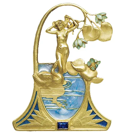 Брошь с изображением обнажённой женщины, сушищей длинные косы в обрамлении из эмалевых золотых кувшинок. Женщина смотрит на лебедя, плавающего в синем пруду с переливчатой ​​мозаикой у её ног. Лебедь приближается к ней, направив клюв в её сторону. В основании обрамления, между двумя кувшинками, находится тёмно-синий сапфир, обрамлённый прямоугольной рамкой. Рене Лалик. Около 1898 года, Франция.